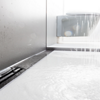 The shower channel with surface-guided single-point drainage offers versatile design and is particularly hygienic.