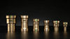 line up of MegaPress transition couplings on black background