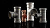 Line up of several Viega fittings on a black background
