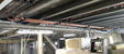 Image of a ceiling under construction full of copper pipes