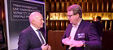 Im Rahmen des Parlamentarischen Abends präsentierte Viega Vice President Global Marketing Dirk Thielker (li.) im Gespräch mit DENEFF-Vorstandsvorsitzendem und Mitglied des Bundestages Carsten Müller das Trinkwassermanagement-System „AquaVip Solutions“, das die energetische Effizienz in der Warmwasserbereitung deutlich steigert. (Foto: DENEFF/Marco Urban)