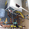 Pipe connections around residential boiler creating secure and efficient heating system