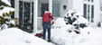 Residential home in winter conditions highlighting plumbing systems at risk from freezing temperatures