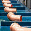 Close-up of Viega metal press fittings during manufacturing process at Kansas production facility
