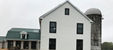 Microbrewery facility with piping systems supporting beer production and taproom operations