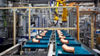 45 degree copper elbows on a conveyor belt