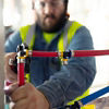 Contractor installing pex fitting with pressgun