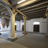 The rooms were initially used to store grains and then, subsequently, farm machinery. Thanks to an investment of 5 million euros from a cultural foundation, the historic granary can now be used as a museum.