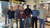 Group of interns taking a group photo inside a Viega facility 
