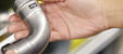 Close-up of person holding Viega MegaPress fitting for carbon steel piping systems