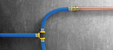 Mixed piping system with PEX tubing and metal pipe used in water distribution installation