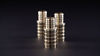 Three PureFlow Crimp fittings on a black background