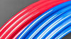 Close up of rolls of red and blue PEX tubing
