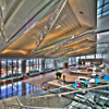 Aviation themed inside and out, the building makes you feel as if you are entering an aircraft, with a swooping roof line, a terrazzo floor designed with inspiration from the contrails of plane flying.